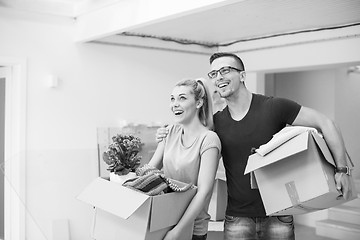 Image showing young couple moving into a new home