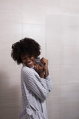 Image showing beautiful black woman wearing  bathrobe