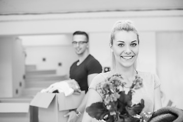 Image showing young couple moving into a new home