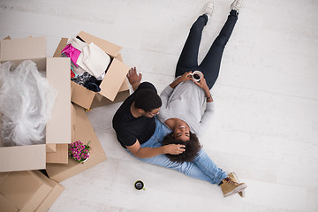 Image showing African American couple relaxing in new house