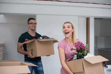 Image showing young couple moving into a new home