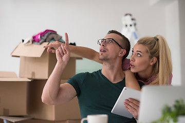 Image showing Young couple moving in a new home