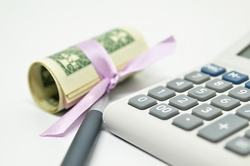 Image showing Calculator, money and pen isolated on white