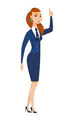 Image showing Stewardess with open mouth pointing finger up.