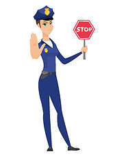 Image showing Caucasian policewoman holding stop road sign.