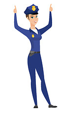 Image showing Policewoman standing with raised arms up.