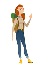 Image showing Young caucasian traveler waving her hand.