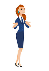 Image showing Caucasian confused stewardess shrugging shoulders