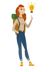 Image showing Traveler pointing at bright idea light bulb.