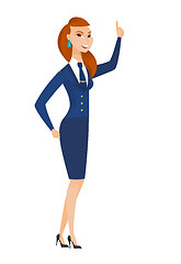 Image showing Caucasian stewardess pointing with her forefinger