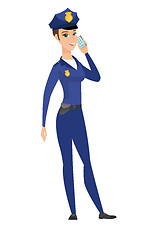 Image showing Policewoman talking on a mobile phone.