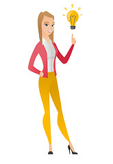 Image showing Business woman pointing at business idea bulb.