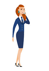 Image showing Stewardess talking on a mobile phone.