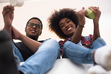 Image showing couple having break during moving to new house