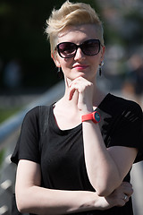 Image showing young woman with short blond hair and sunglasses