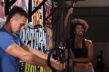 Image showing Portrait of multiethnic couple  after workout at gym