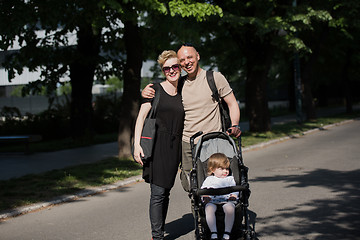 Image showing couple with baby pram in summer park