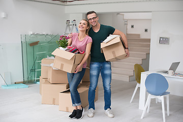 Image showing young couple moving into a new home