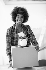 Image showing Black girl moving in the new apartment