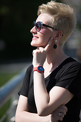 Image showing young woman with short blond hair and sunglasses