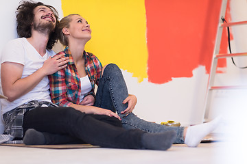 Image showing Happy young couple relaxing after painting