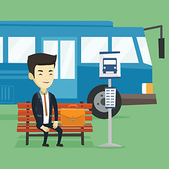 Image showing Business man waiting at the bus stop.