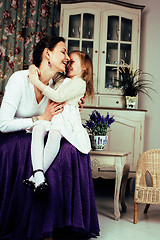 Image showing young mother with daughter at luxury home interior vintage