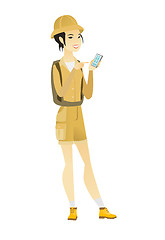 Image showing Asian traveler holding a mobile phone.