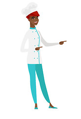 Image showing African-american chef cook pointing to the side.