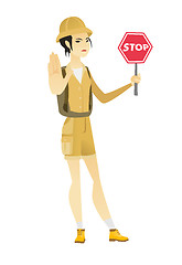 Image showing Asian traveler holding stop road sign.