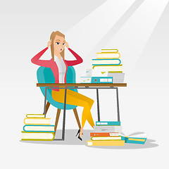 Image showing Student sitting at the table with piles of books.