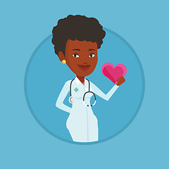 Image showing Doctor cardiologist holding heart.