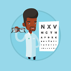 Image showing Professional ophthalmologist holding eyeglasses.