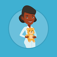 Image showing Pediatrician doctor holding teddy bear.