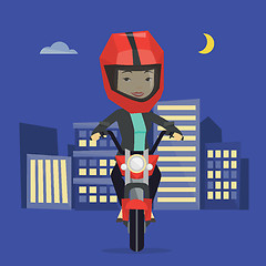 Image showing Woman riding motorcycle at night.