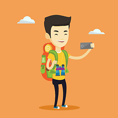 Image showing Man with backpack making selfie.