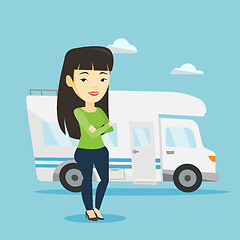 Image showing Woman standing in front of motor home.