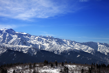 Image showing Sunlight snow mountains and blue sky with clouds in winter day