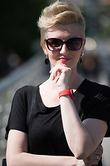 Image showing young woman with short blond hair and sunglasses