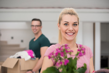 Image showing young couple moving into a new home