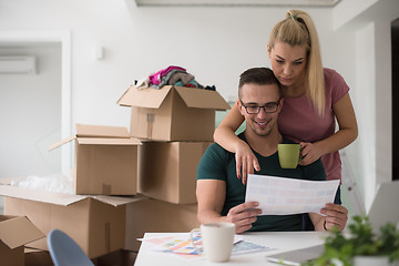 Image showing Young couple moving in a new home