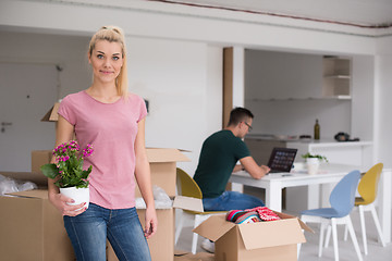 Image showing young couple moving into a new home