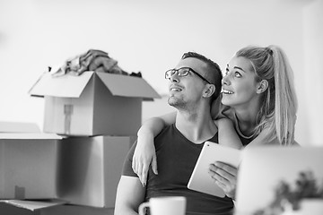 Image showing Young couple moving in a new home