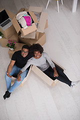 Image showing African American couple  playing with packing material