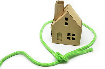 Image showing Paper house surrounded by green rope