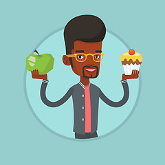 Image showing Man choosing between apple and cupcake.