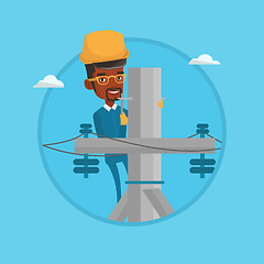 Image showing Electrician working on electric power pole.