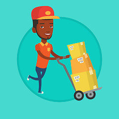 Image showing Delivery postman with cardboard boxes on trolley.