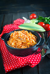 Image showing fried cabbage in bowl and on a table