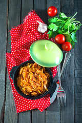 Image showing fried cabbage in bowl and on a table